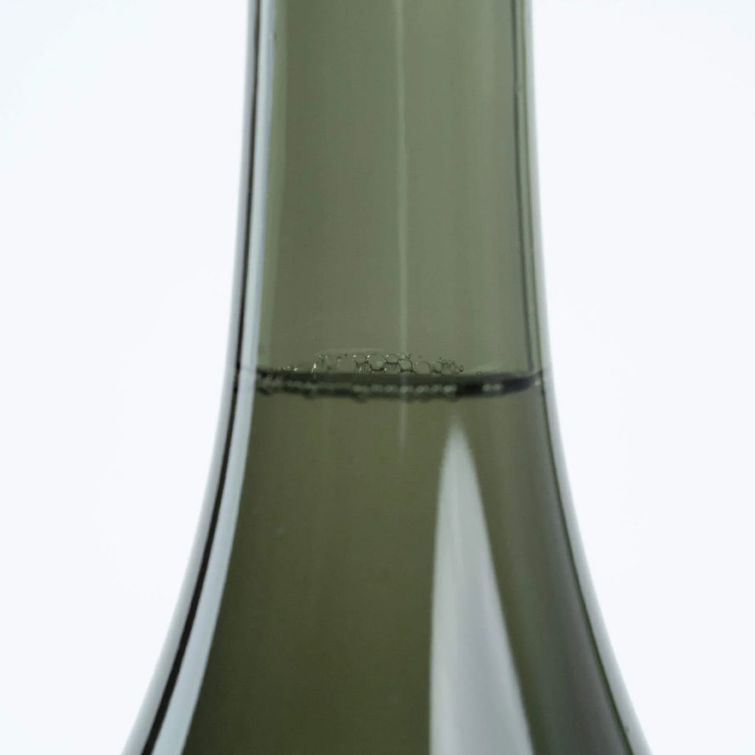 The crystal clear liquid texture of Juyondai Ryusen pour. The pinnacle of sake craftsmanship.